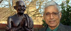 Rajmohan Gandhi with bust of his grandfather